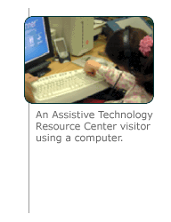 Image: closeup of a resource center visitor using a computer.